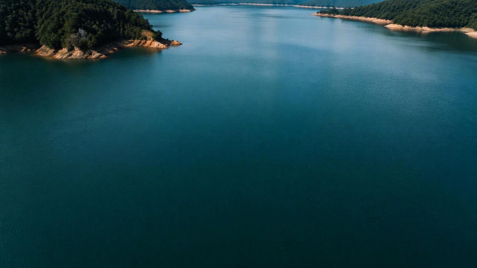 Aerial view of a water reservoir at dusk
